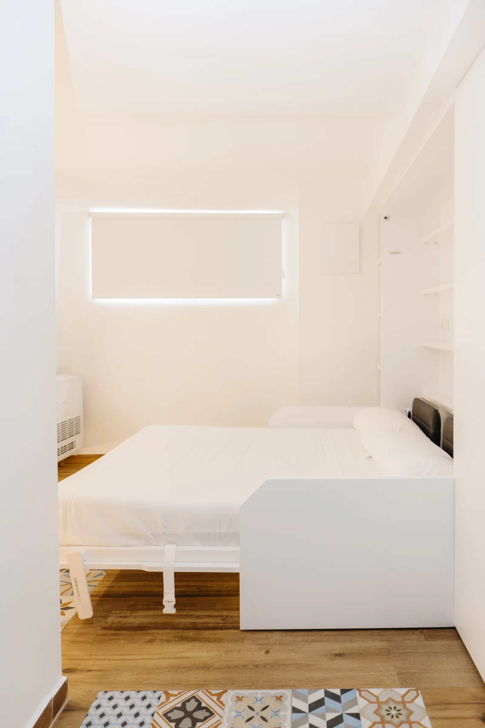 Cama abatible desplegada en el dormitorio de Pinot Noir